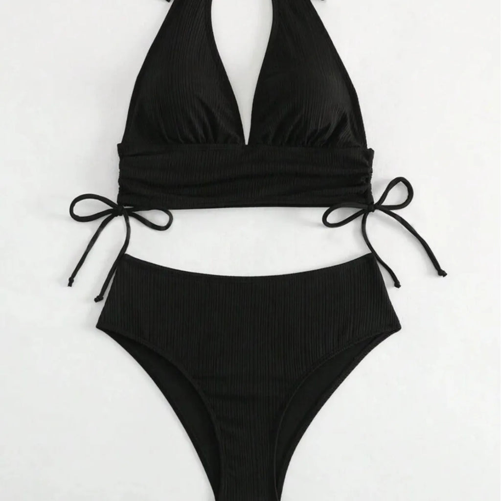 Black and pink women's lace-up halter bikini set with briefs, made from polyester fabric.