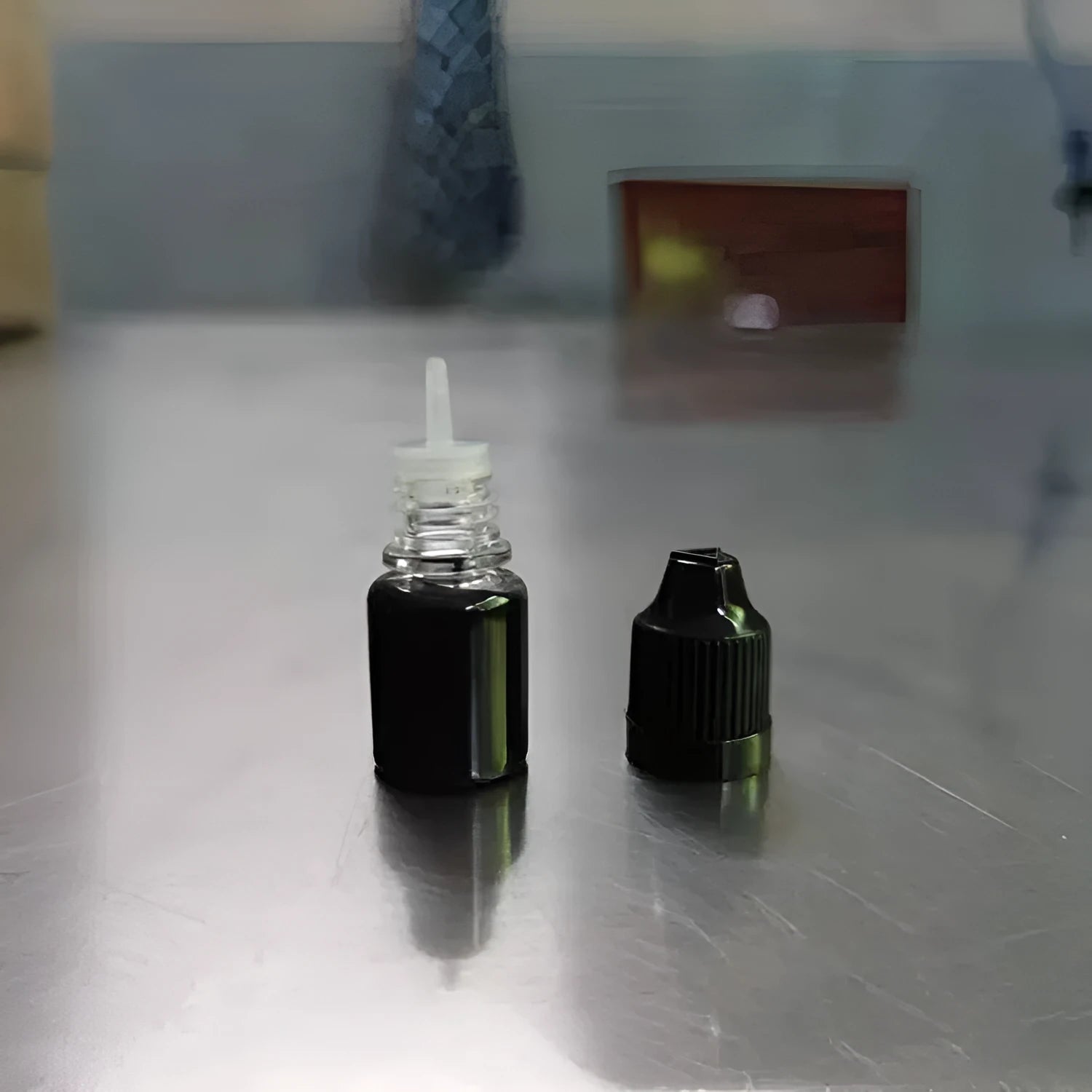 A small bottle containing 5ml of black confidentiality seal ink for privacy stamps.