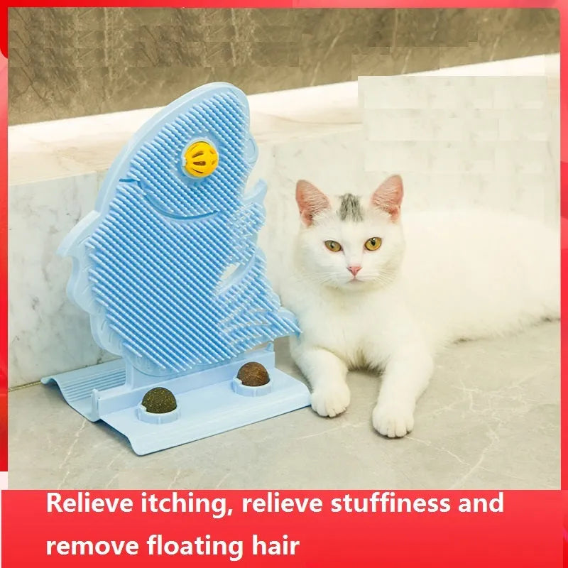 Blue fish-shaped cat wall scratcher toy with brush, catnip balls, and a bell on a white base.
