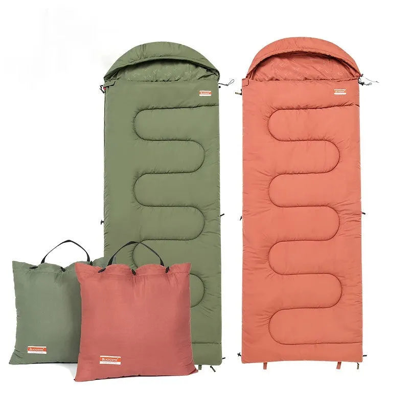 Portable ochre and olive green cotton sleeping bag quilt laid out flat, showing its quilted design for camping.