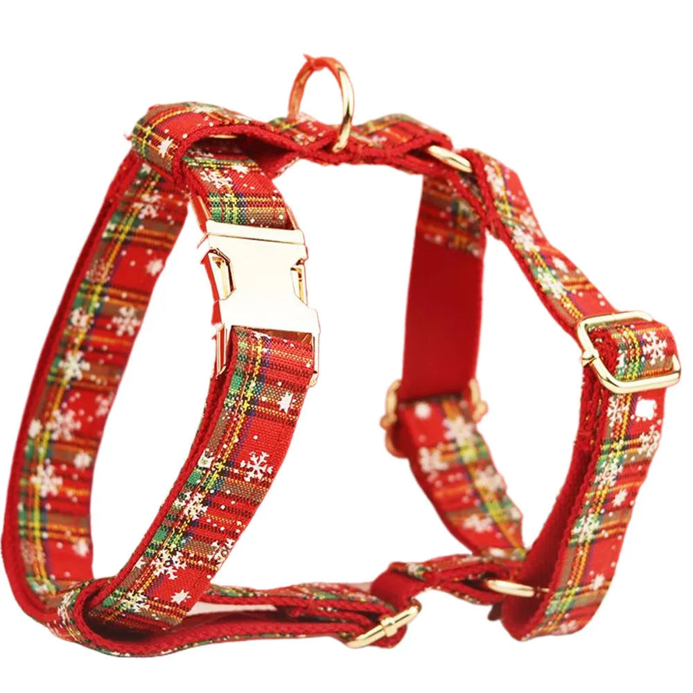 Four-piece Christmas pet accessory set with red snowflake collar, plaid leash, festive vest, and bow tie