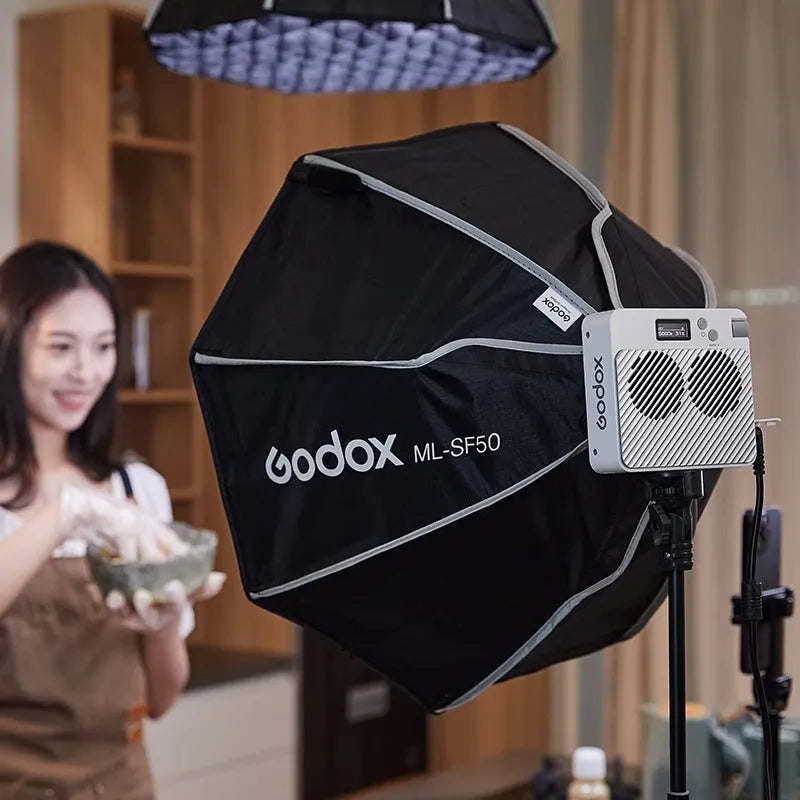 shenniu ML100Bi continuous LED video light with lenses and accessories on a table