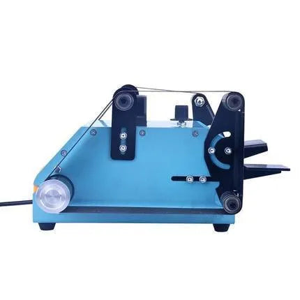 Blue desktop dual-axis belt sander with variable speed switch, shown on a workbench.