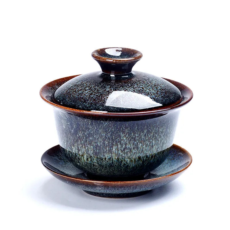Three-piece ceramic tea set with covered bowl and teacup in black transmutation glaze finish