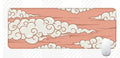 Large cloud pattern desk mat made of natural rubber on a wooden desk.
