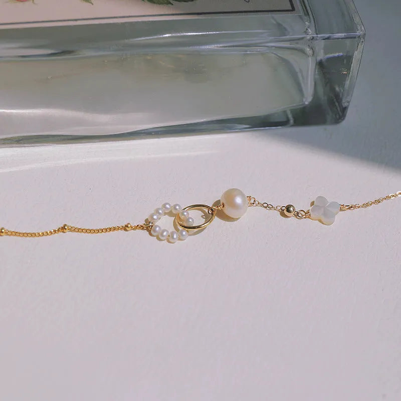 Natural pearl women's bracelet with a 14k gold-plated setting on a single strand.
