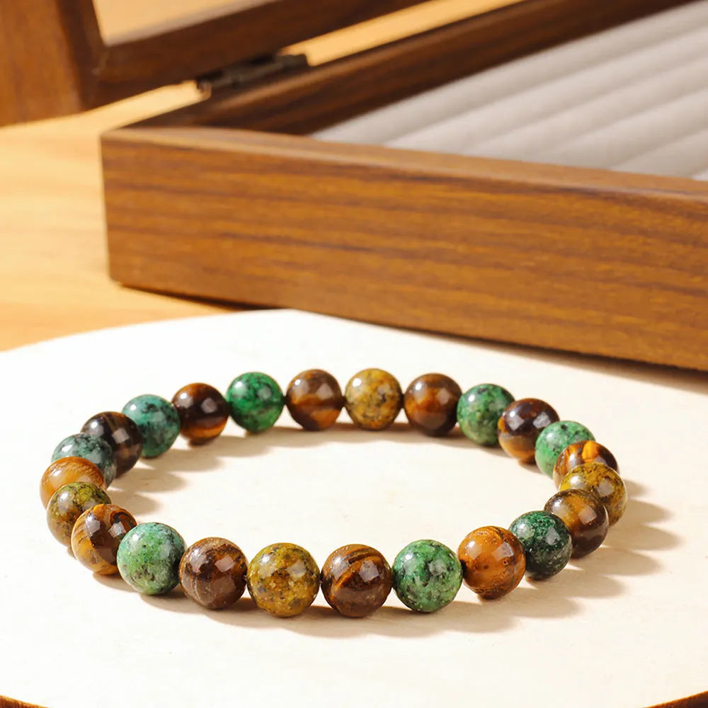 Handmade tigereye stone bracelet with antique floral design and adjustable cord fastening