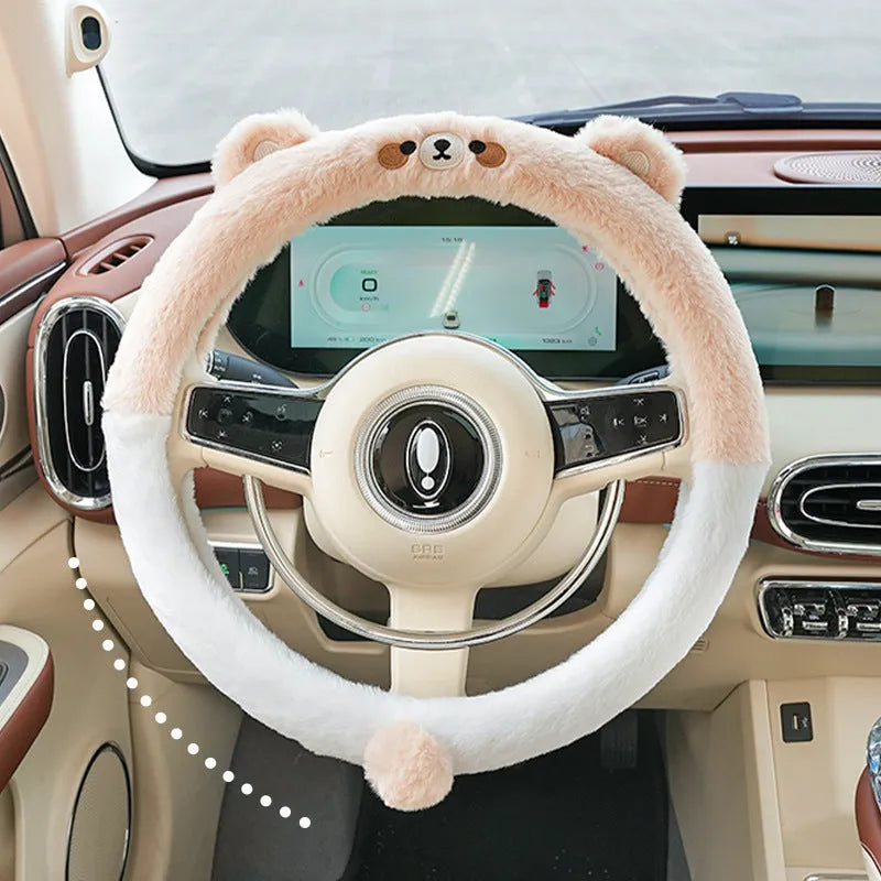 Plush cartoon animal steering wheel cover with embroidery, shown fitted on a car wheel.