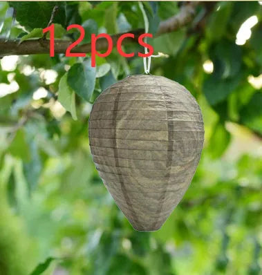 Paper beehive lantern with honeycomb structure, shown in assorted colours, measuring 22cm wide by 28cm high.