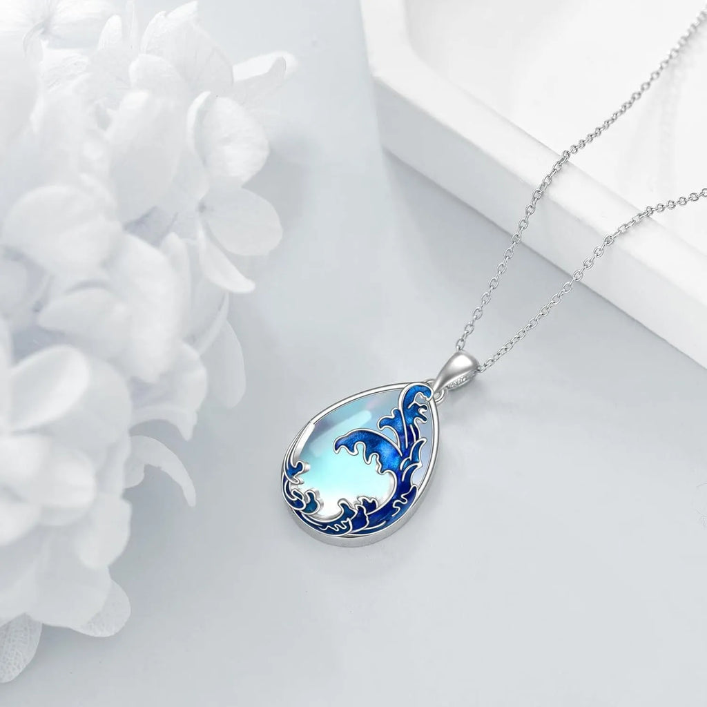 Moonstone blue alloy heart pendant on a women's necklace chain.