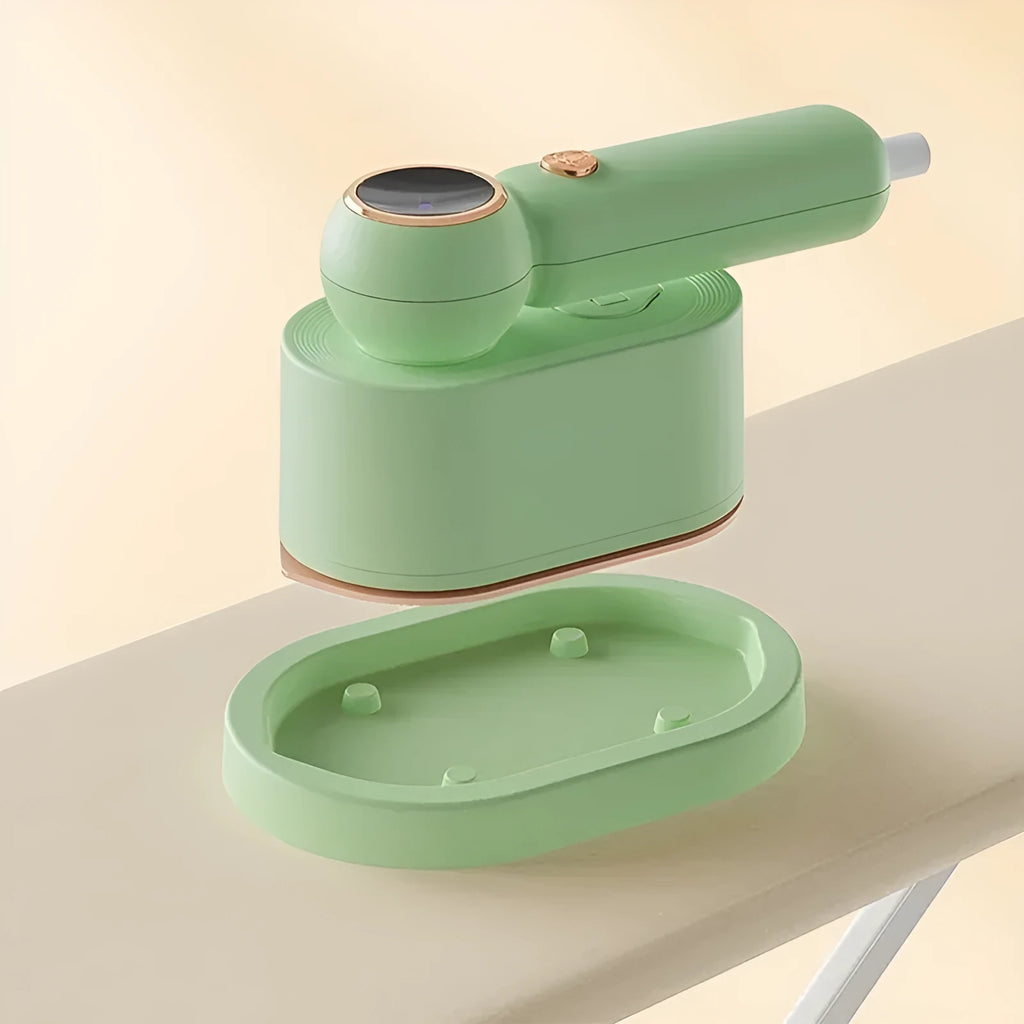 Green 800W portable garment steamer with foldable handle and titanium alloy panel, 70ml water fill, 1.6m cable, EU or UK plug.