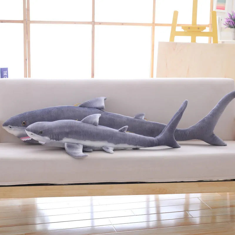 Lifelike soft shark plush toy in shark colour, available in 60cm, 100cm, and 140cm heights, net pocket packaging