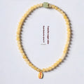 Women's hand-woven topaz bracelet with barrel beads and square sugar jade beads featuring fu character