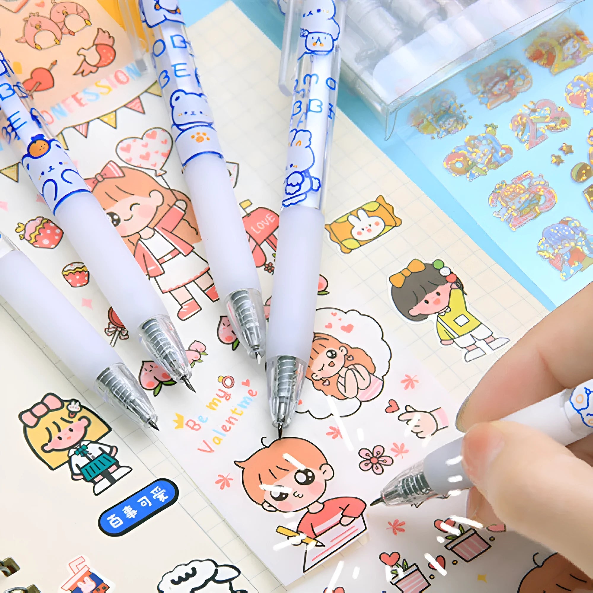Six assorted press pen knives with bear and rabbit character designs on a table.