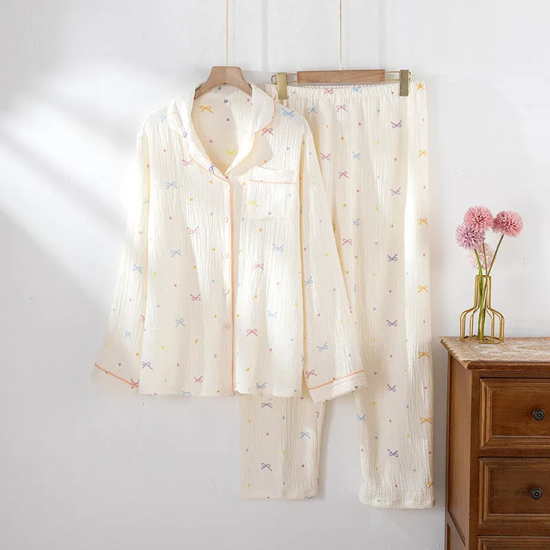 Women's long sleeve cotton pyjama set in pink, featuring a casual top and trousers.
