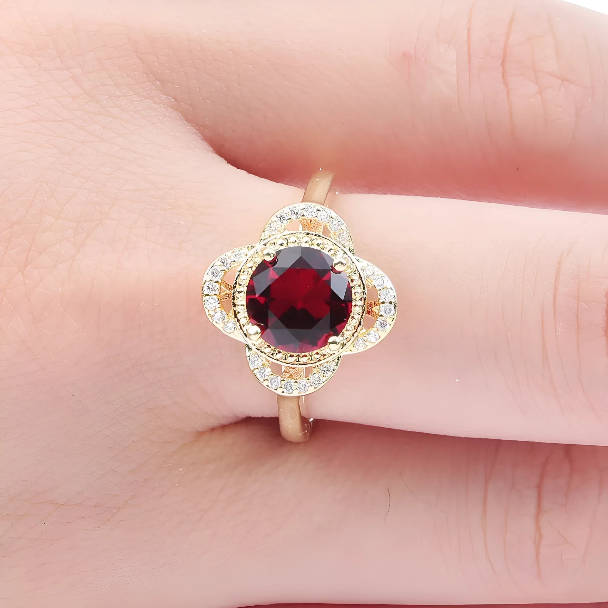 Copper ring with a silver-toned zircon fruit-shaped inlay on a band.