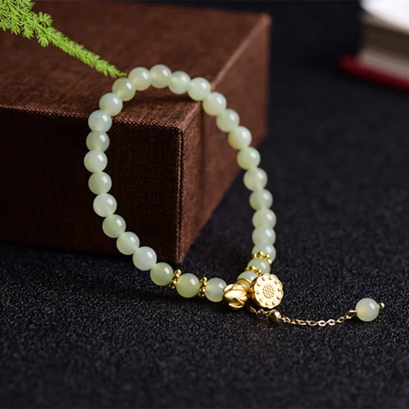 Two Shihuan natural Hetian jade bracelet with 6mm beads showing lotus and fu character designs