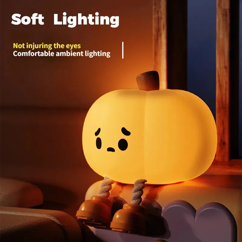 Soft silicone pumpkin-shaped night light with dimmable touch control on bedside table