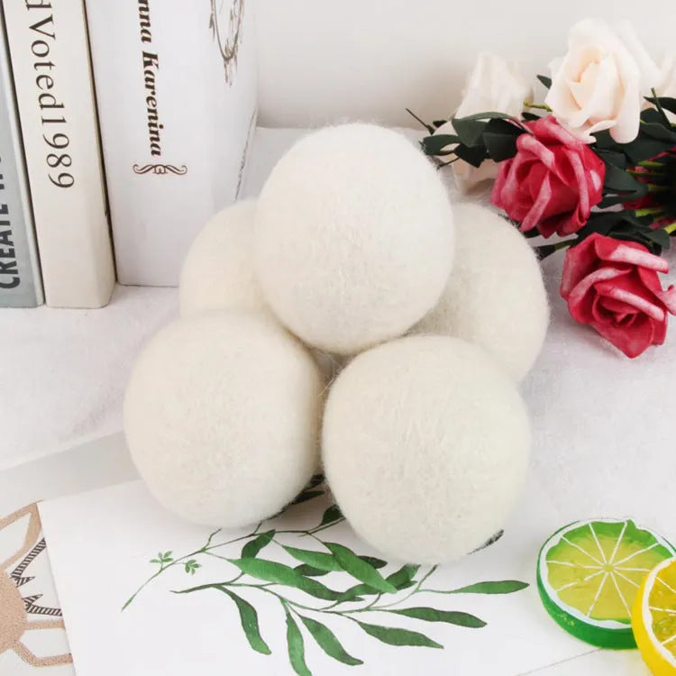 Set of natural wool drying balls with cotton storage bag for laundry static reduction