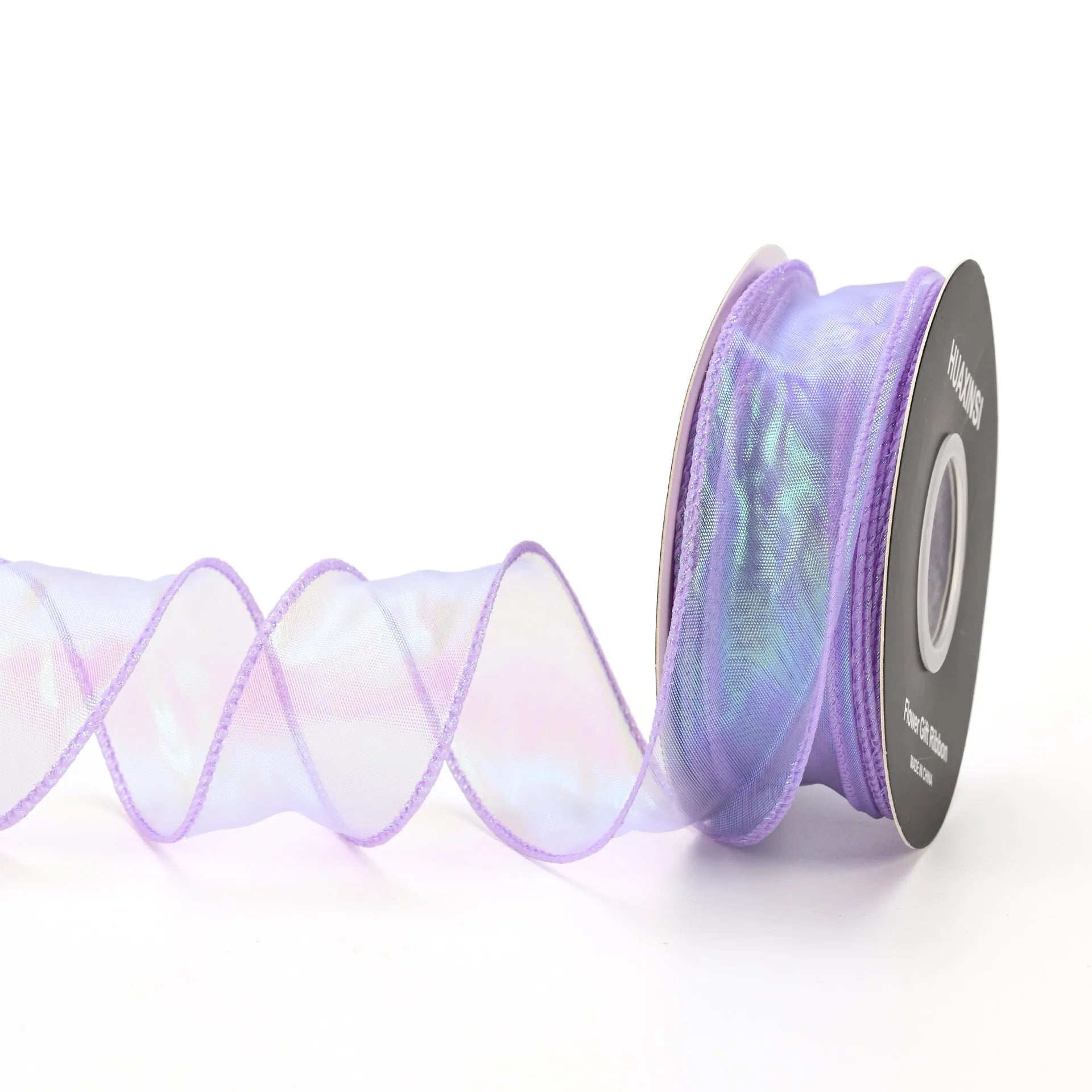 Roll of colourful fishtail yarn mesh ribbon showing its textured, wavy edge, with a colour selection including pink, yellow, and blue.