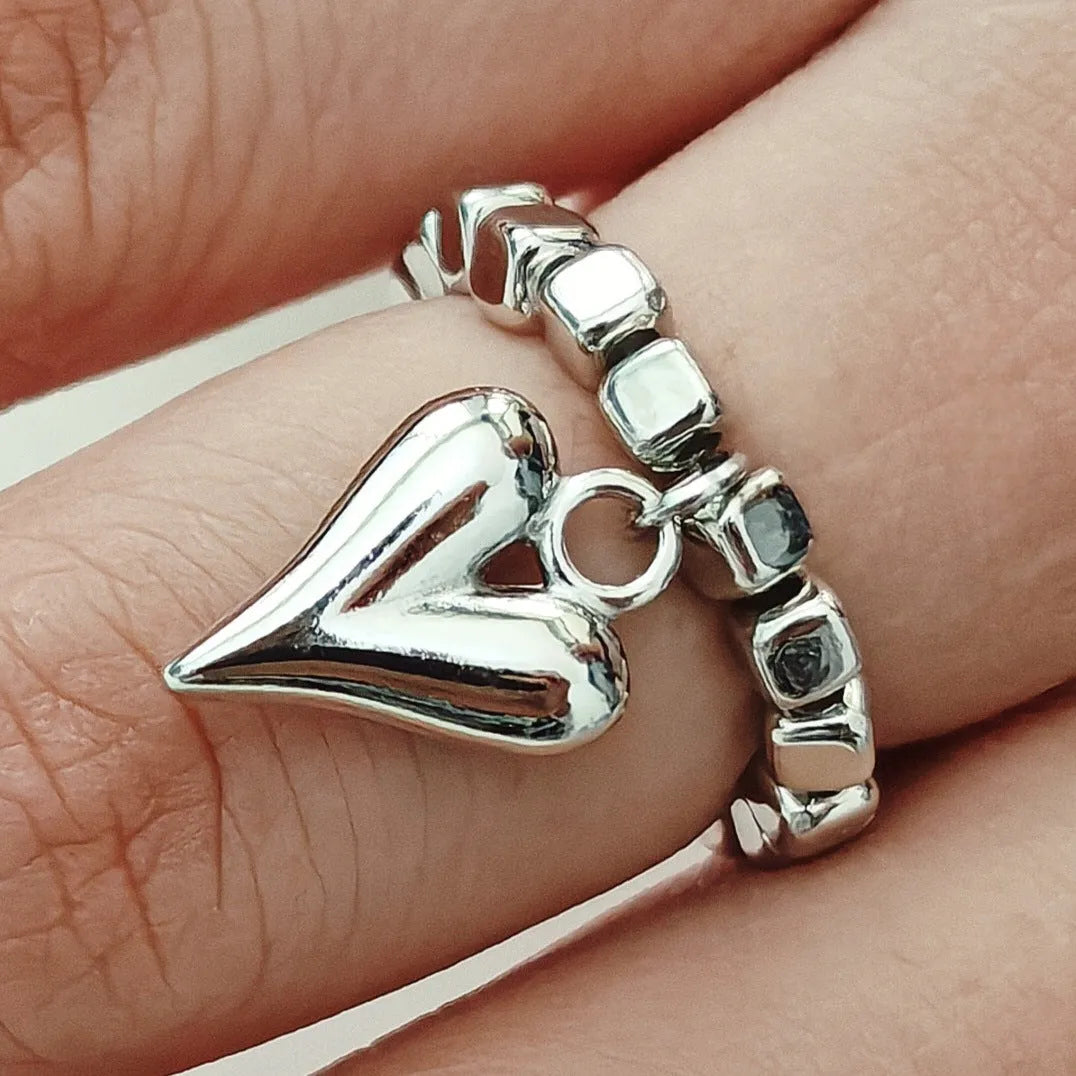 Handmade elastic beaded love ring with geometric heart design in gold and white electroplated finishes