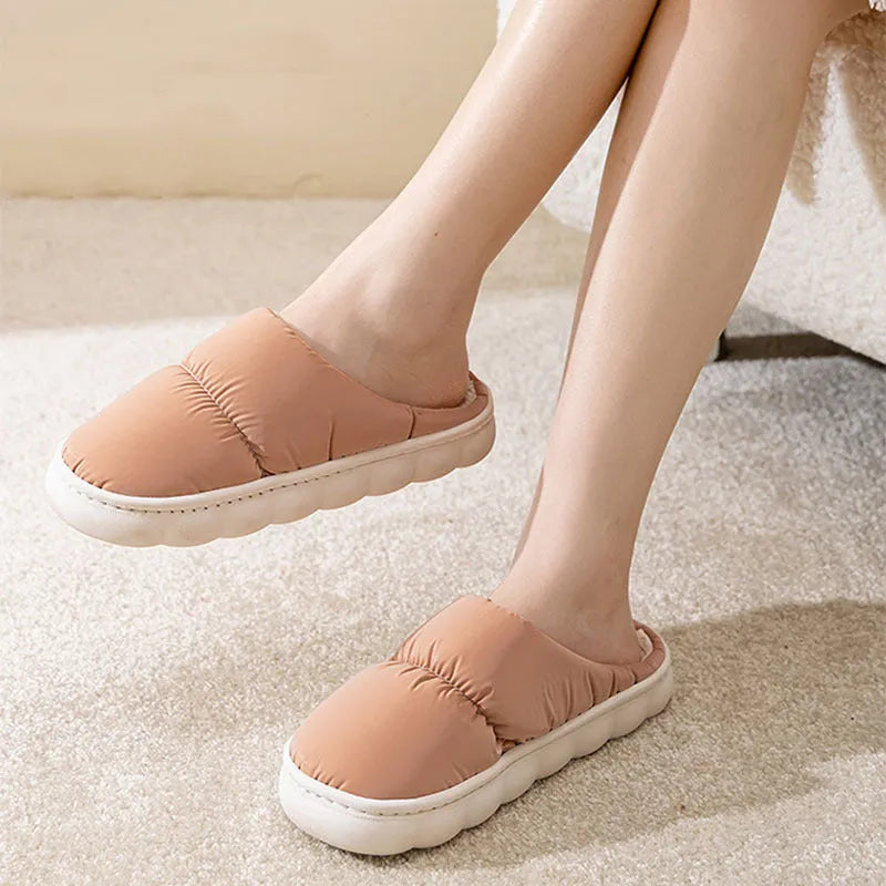 Blue down cotton winter slippers with thick rubber sole and plush lining for indoor use.
