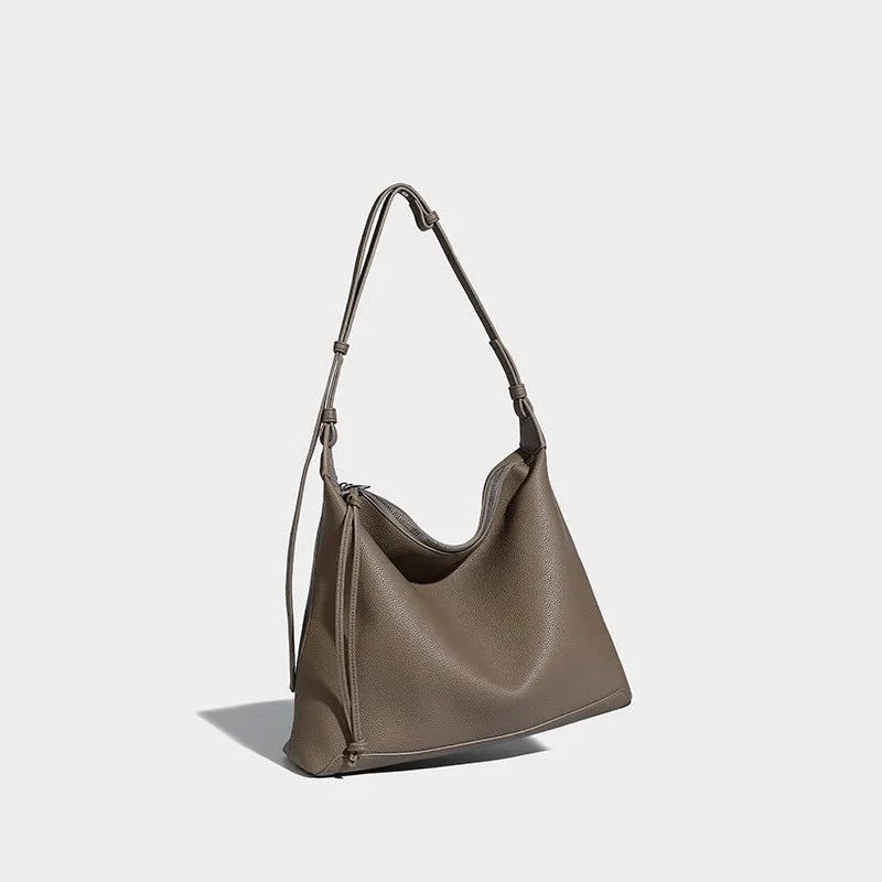 Large caramel coloured PU messenger bag with shoulder strap showing 36cm length