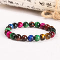 Colourful Tigereye natural stone bracelet with geometric round beads in multiple sizes on wrist
