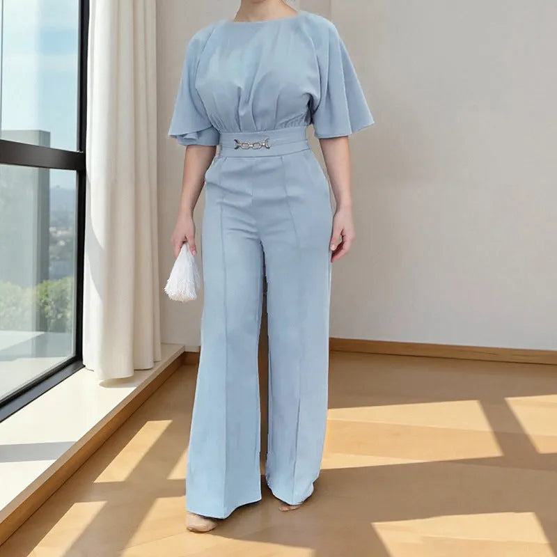 Blue men's polyester suit set with long-sleeved jacket and trousers on a hanger.