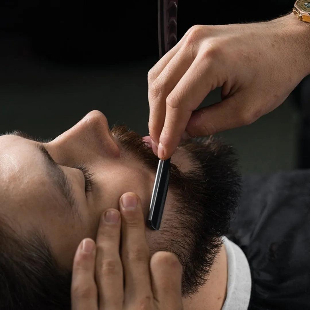 Old-fashioned manual beard shaving and eyebrow cutting hair trimmer in black without blade