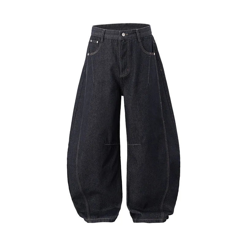 Men's wide leg denim trousers in original cow colour showing mid waist and relaxed fit.