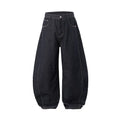Men's wide leg denim trousers in original cow colour showing mid waist and relaxed fit.