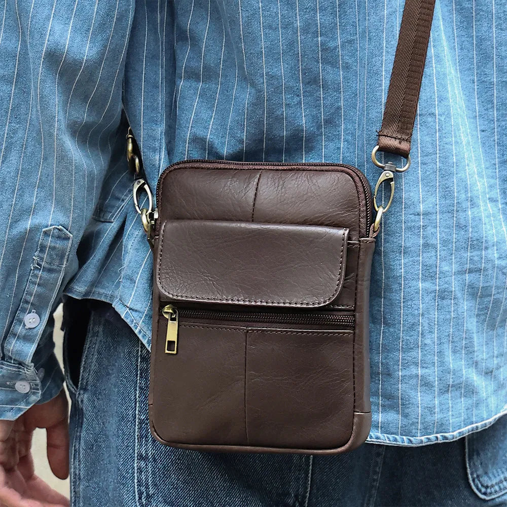 Men's brown leather crossbody shoulder bag with visible stitching and crossbody strap