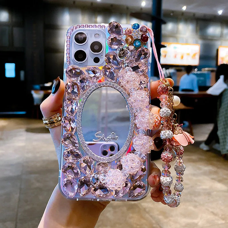 Pink diamond-encrusted mirror silicone phone case for Apple iPhone, reflective surface with crystal pattern