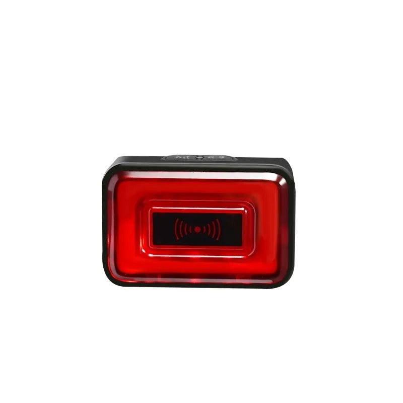 Compact black radar bicycle tail light with dual buttons mounted on a bike seat post