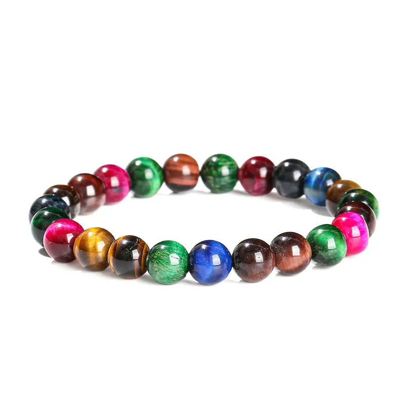 Colourful Tigereye natural stone bracelet with geometric round beads in multiple sizes on wrist