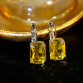 Square crystal earrings in copper with 25mm by 10mm dimensions, available in purple, red, and yellow.