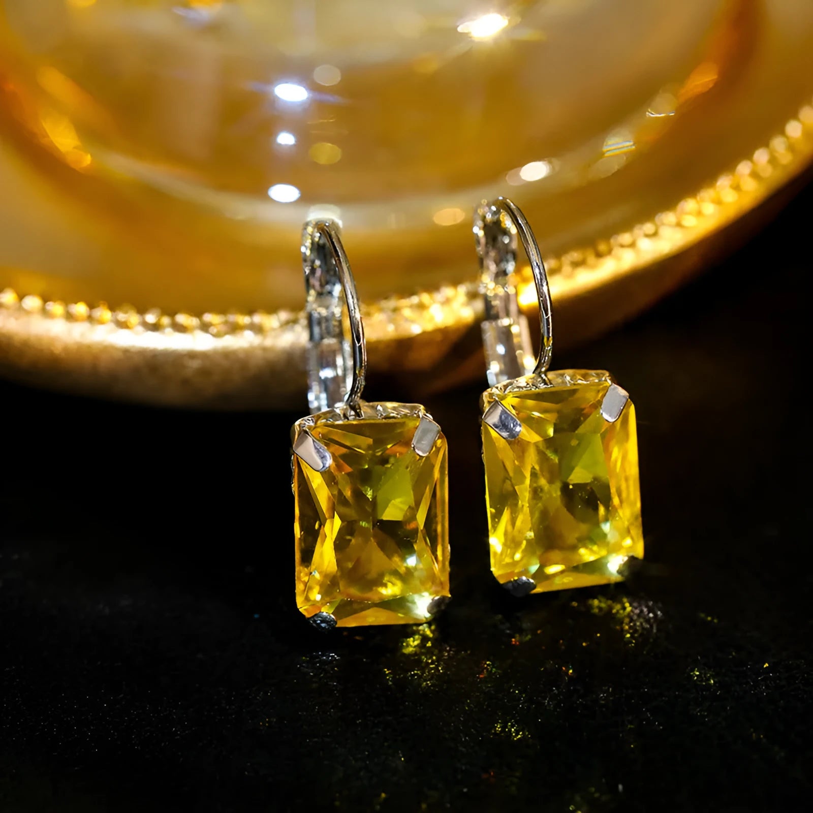 Square crystal earrings in copper with 25mm by 10mm dimensions, available in purple, red, and yellow.