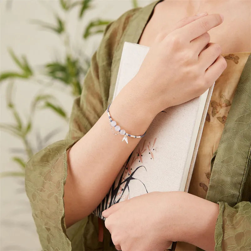 Hetian jade diamond-shaped bracelet with lotus seedpod design and woven carrying strap in light green or haze blue colour options