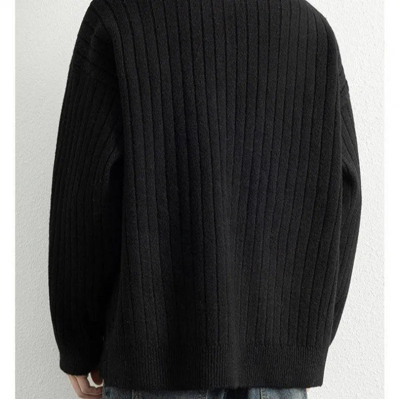 A grey men's textured knit half-zip pullover sweater on a hanger, showing the loose fit and long sleeves.