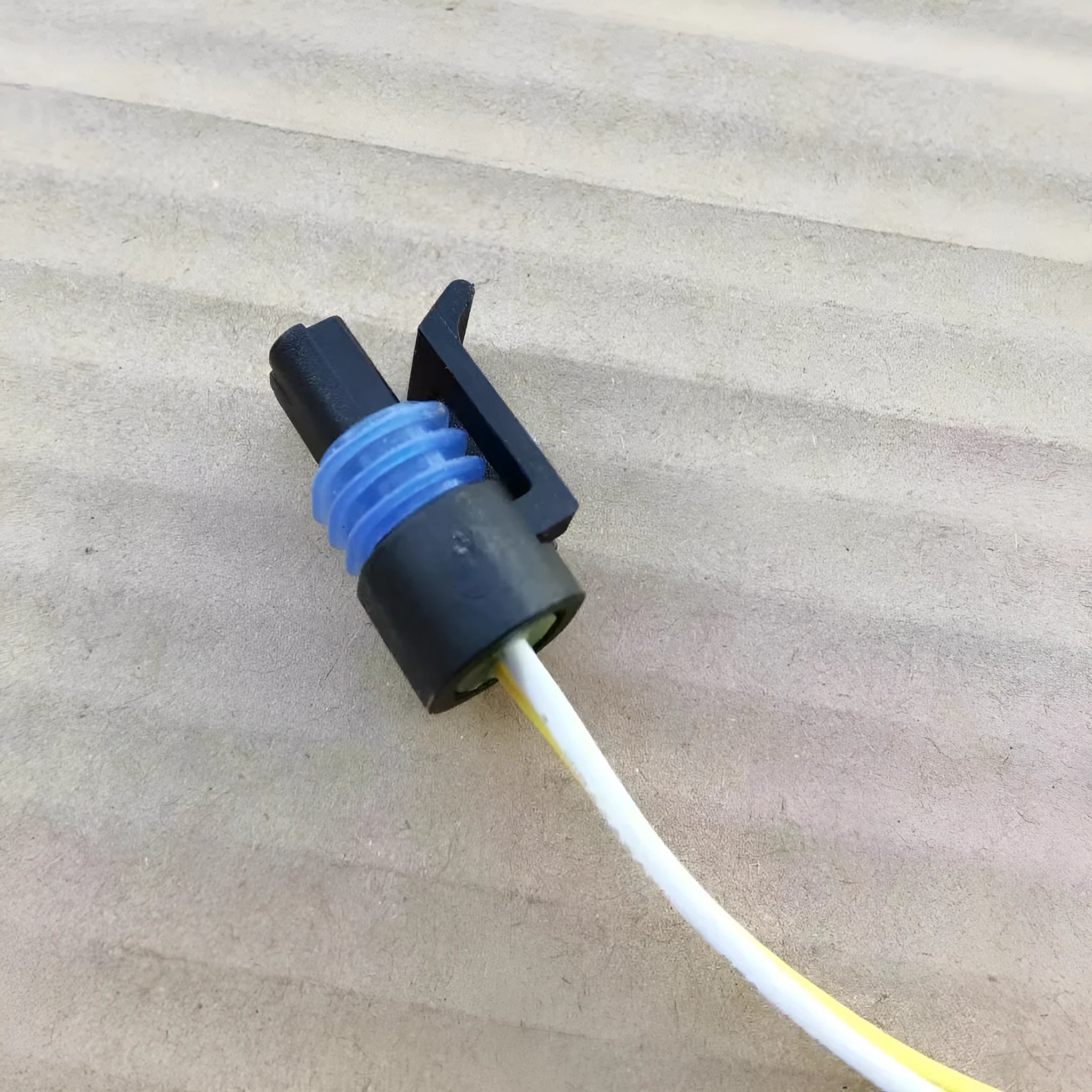 ACDelco brand engine coolant temperature sensor plug connector for automotive repair.