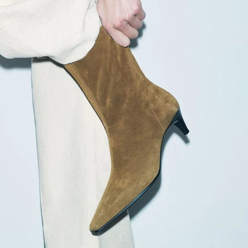 Women's brown square toe ankle boots with a side zip and a stiletto kitten heel on a white background.