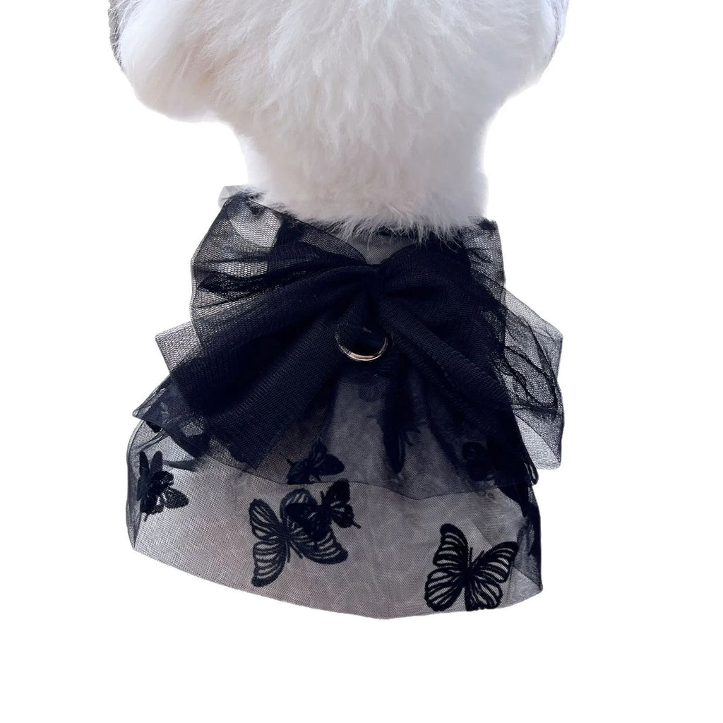 Black layered tulle princess skirt on a small dog, showing the full skirt silhouette and secure fit.