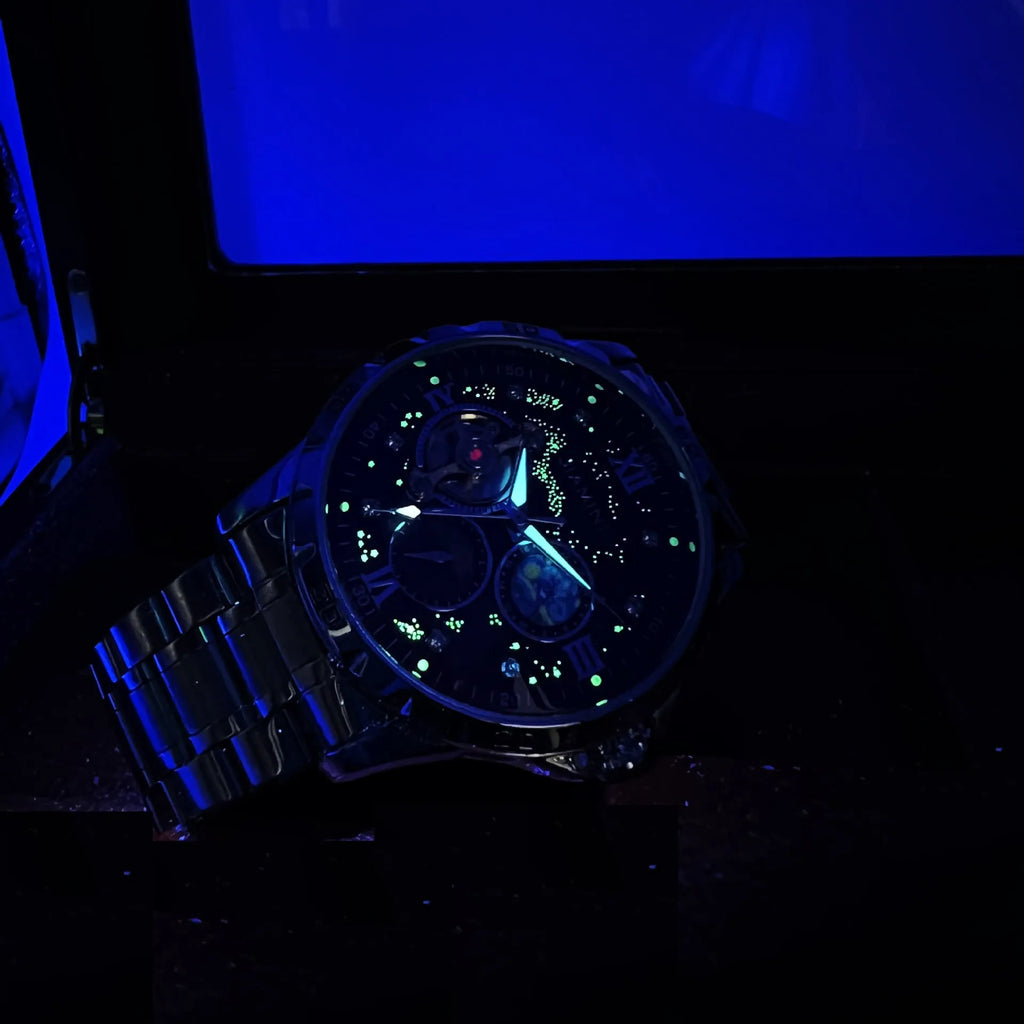 Automatic mechanical men's wristwatch with rose gold case and black dial on a strap.