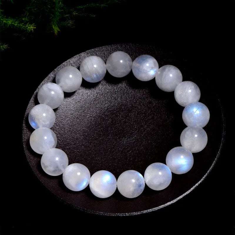 Natural blue moonlight round bead moonstone bracelet on a white background.