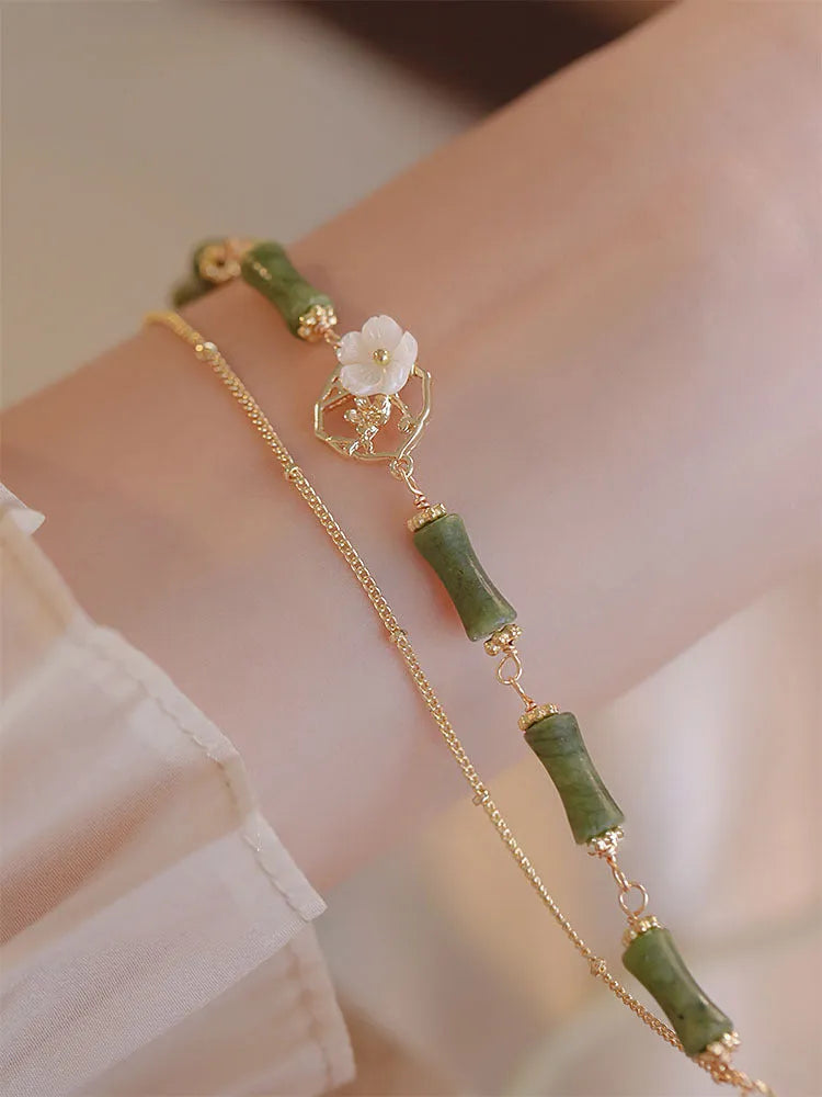 Natural olivine double layer bracelet with twin bells of Ireland charms and olive branch elements