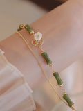 Natural olivine double layer bracelet with twin bells of Ireland charms and olive branch elements