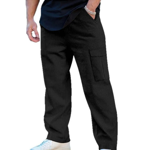 Man wearing navy blue loose-fit corduroy cargo trousers with a drawstring waist.