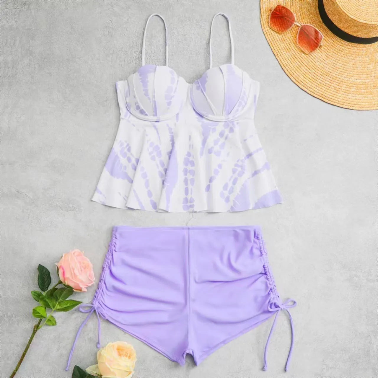 Women's printed split bikini swimsuit set showing top and shorts in blue colour option
