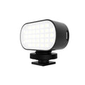Black ST-30 mobile phone fill light with digital display and cold shoe mount for photography.
